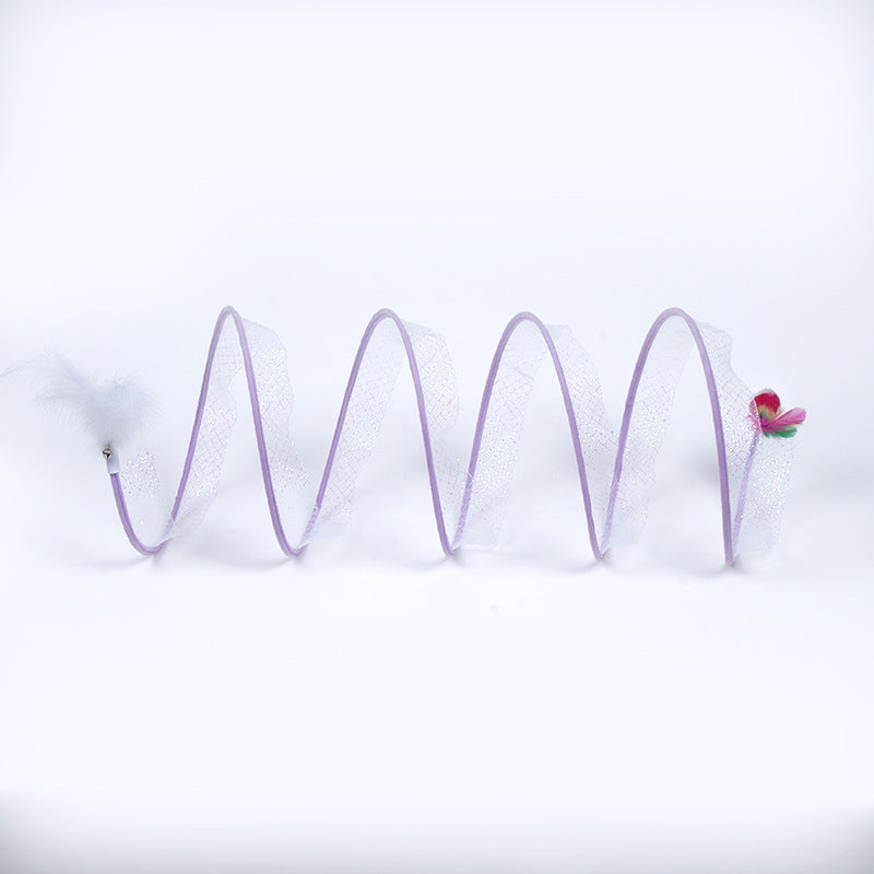 Spiral spring with a small pink object on a white background