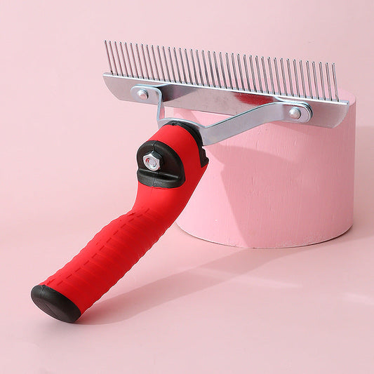 Pet grooming tool with red handle and metal comb on a pink background
