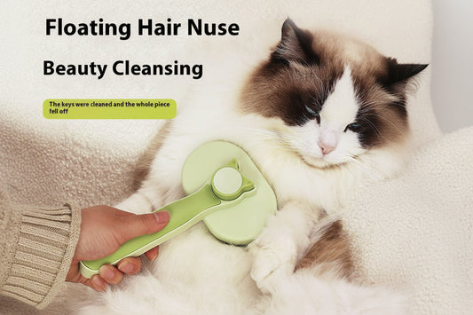 Green pet grooming tool with text 'Floating Hair Nuse Beauty Cleansing' on a fluffy surface with a cat.