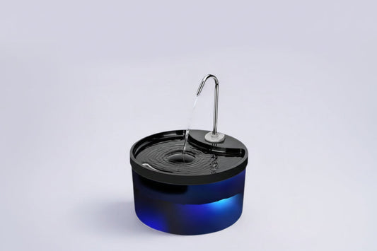 Pet water dispenser with blue base and black top on a light gray background